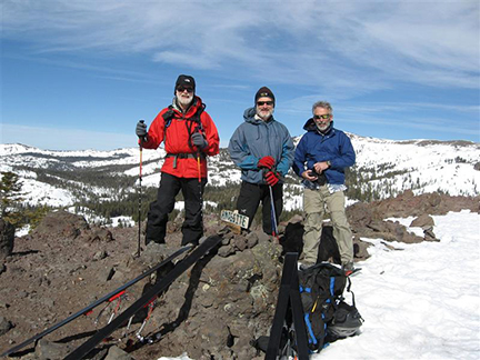 Image of skiers on top of Andesite Peak.