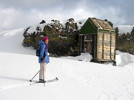 Image of of a miner's cabin that lies to the southeast on the ridge and just to the northwest of Peak 7605.
