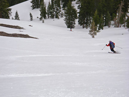 Image of skier descend from final saddle