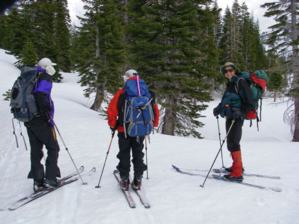 Image of skiers rounding knob