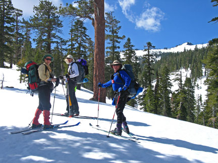 Image of skiers on ridge leading to Deep Creek
