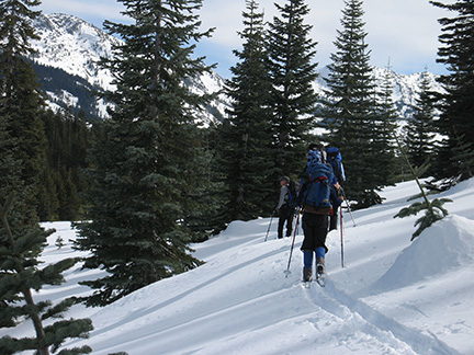 Image of skiers descending into Milkhouse Meadow