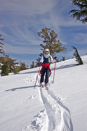 Image of skier descending from Round Top Lake