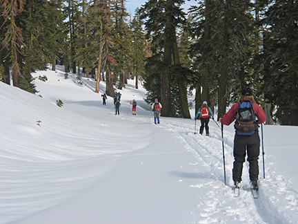 Image of skiers on road leading to quarry.