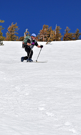 Image of skier at top of Ten Turn Hill