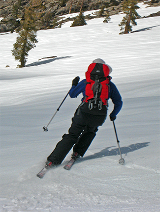 Image of skier at bottom of great descent