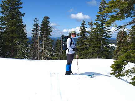 Image of skier and view north from Blue Creek Point